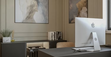 a computer desk with a computer monitor and a monitor