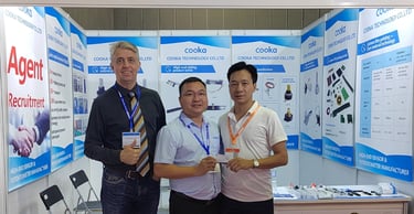 three men standing in front of a display of a display of a display of a