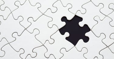 a puzzle piece of puzzle pieces with a hole in the middle symbolizing personal developement