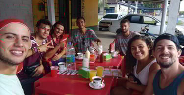 a group of people sitting at a table with drinks