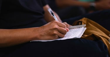 person making notes