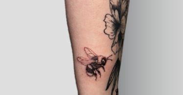 a bee on a man's arm with a bee on it
