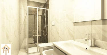 Modern bathroom featuring marble tiles, a glass walk-in shower, and a white vanity with chrome faucet.