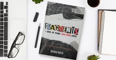 a book cover of the Fragments  book with a laptop and a cup of coffee