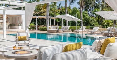 Poolside lounge area with shaded pergola