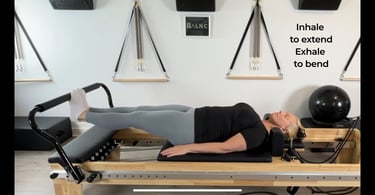 a woman working footwork on the reformer for rehabilitation