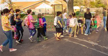 The Benton students walking in a line to Access Arts from school.