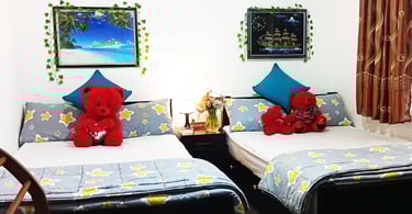 Family room at Nobel Bungalow Nuwara Eliya with double beds and teddy bears – cozy for families