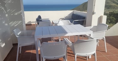 An outdoor eating area with stunning views in Mojacar, Spain.