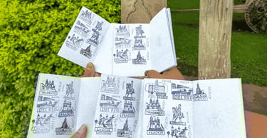 páginas do Passaporte da Estrada Real preenchidas com diversos carimbos turísticos