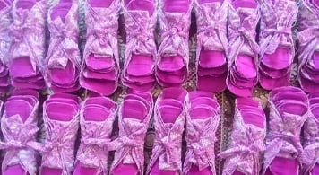 Fifteen packs of pink reusable sanitary napkins.