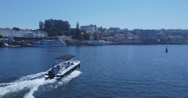 Private boat cruising on Douro River in Porto, Portugal, for scenic tours