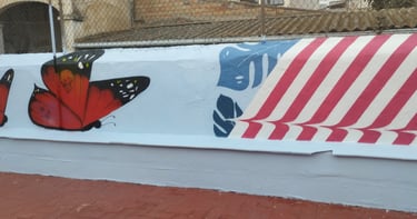 graffiti mural escuela mariposas tramas colores