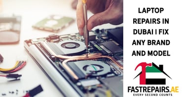 a laptop computer repair technician repairing a laptop