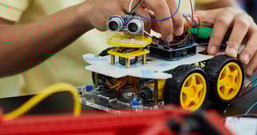 a kid is holding a remote control car