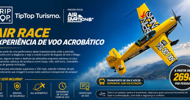 Yellow aerobatic stunt plane flying over a scenic coastline for an Air Race flight experience.