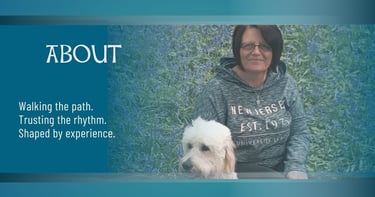 About page banner image showing Sonia Parker seated in a wildflower meadow with her dog beside her, 