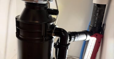 installing a new garbage disposal under a sink in Glendale