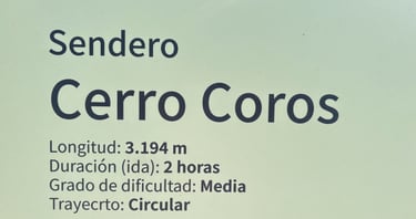 The sign 'sendero Cerro Coros with the hike's description