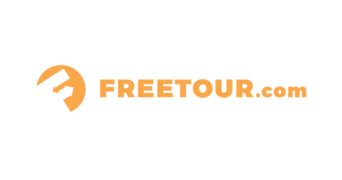 FREETOUR.com orange logo with an abstract arrow icon on a black background for travel bookings.