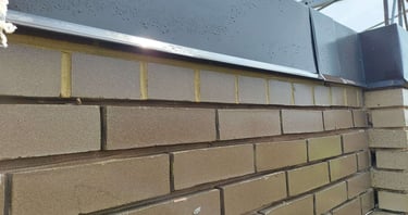 "Tuckpointing and mortar repair on a brick wall by Profaster in Des Moines."