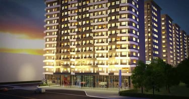 a tall building with a lot of windows and a car parked in front of it