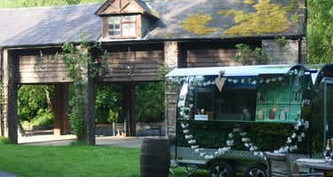 Event trailer in front of wedding barn. Decorated for the occasion.