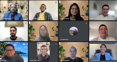 Screenshot of a Zoom call with 10 coaches in a grid view, each smiling and engaged in conversation