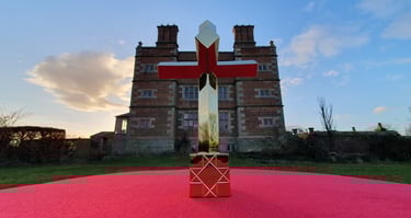One half of the artwork 'In Hoc Signo' shown in front of Soulton Hall.