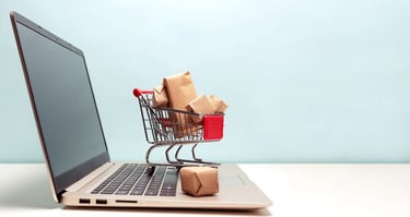 Small Cart Full of Gifts on Laptop Keyboard