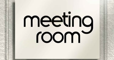 a sign that says meeting room