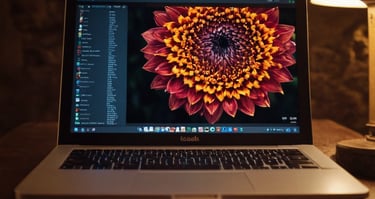 designing a flower logo on a laptop for shropshire web services