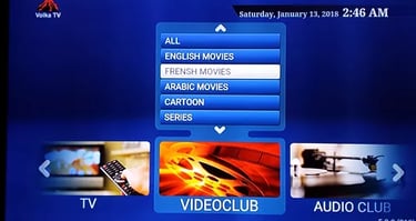 Volka TV digital interface showing a video club menu with movie categories and channel options.