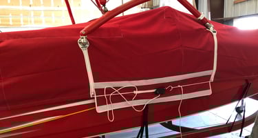 Boat cover with cutouts for ski tower. 