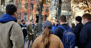 Dr. Hooton discussing LGBTQ+ history in New York City with students. Outside The Stonewall Inn in NY