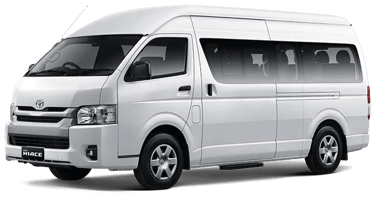 Toyota Hiace warna putih dengan pintu geser menggunakan velg silver.