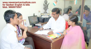 a group of people sitting at a desk