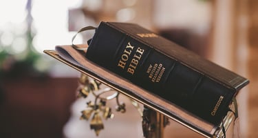 Holy Bible on pulpit in church—Christian faith, Scripture, worship service