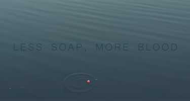 A red fishing bobber floats on calm blue water with the text Less Soap, More Blood.