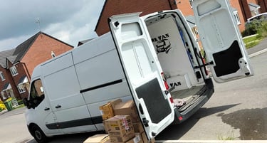 white mr van company van with boxes next to it