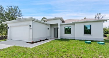 Beautifully designed front elevation of a new home for sale in Lehigh Acres, Florida."
