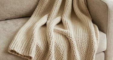 A moody walnut-toned living room bathed in warm amber light, showcasing a serene and inviting atmosphere.