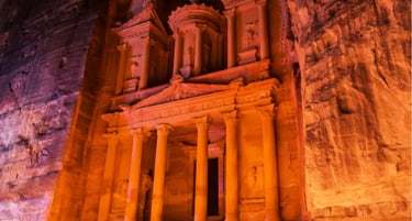 The Treasury at Petra, Jordan illuminated by candlelight at night in the ancient Nabatean city.