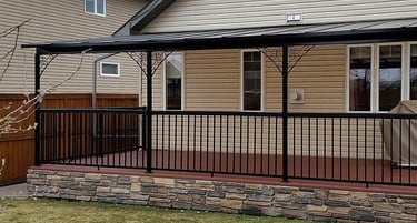 Patio Cover with ornamental post supports and black color.