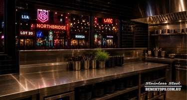 Heavy-duty kitchen work counter and durable stainless steel bench Northbridge at night.