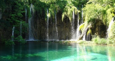 Overnight tour visiting Plitvice National Park and Zadar, including hotel breakfast start.