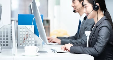 a woman in a headset with a headset and a man in a suit