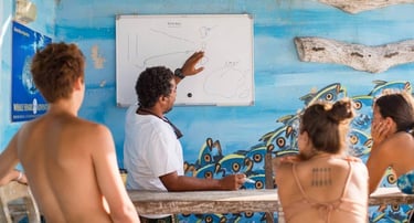 a scuba duka instructor briefing divers