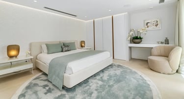 Stylish bedroom at Villa Serenity with soft neutral palette