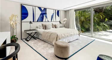 Contemporary bedroom with terrace views at Villa Serenity